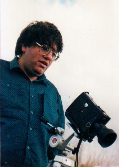 Bill Mousoulis in 1988 with a Super 8 camera.